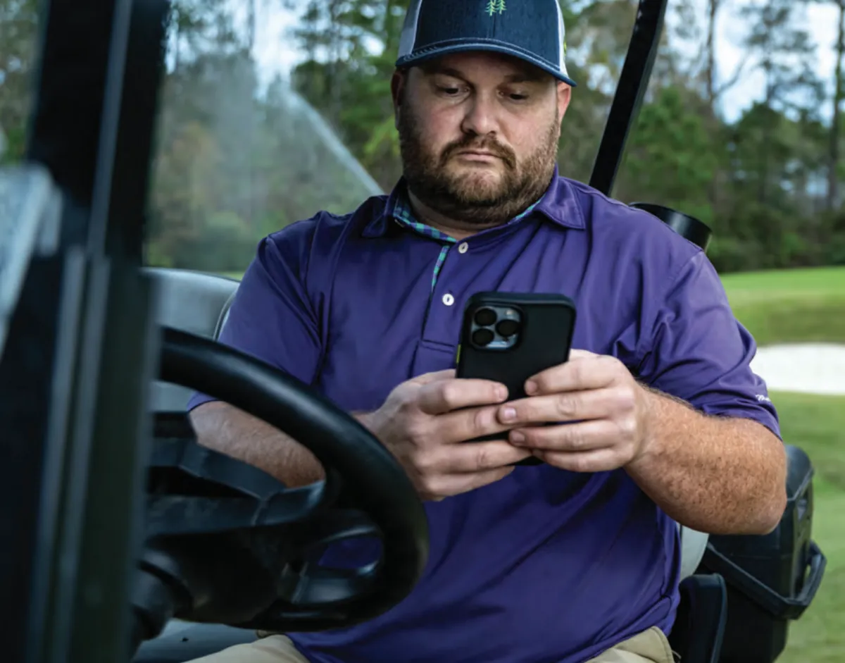 Superintendent using Rain Bird CirrusPRO on a phone